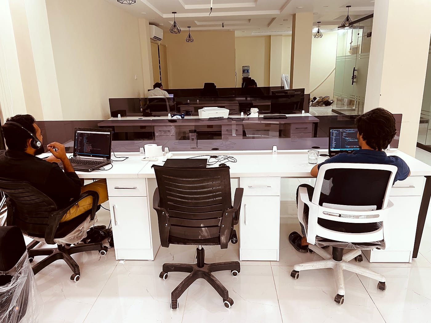 Members at work on the shared floor at CodeUp Spaces, Wapda Town