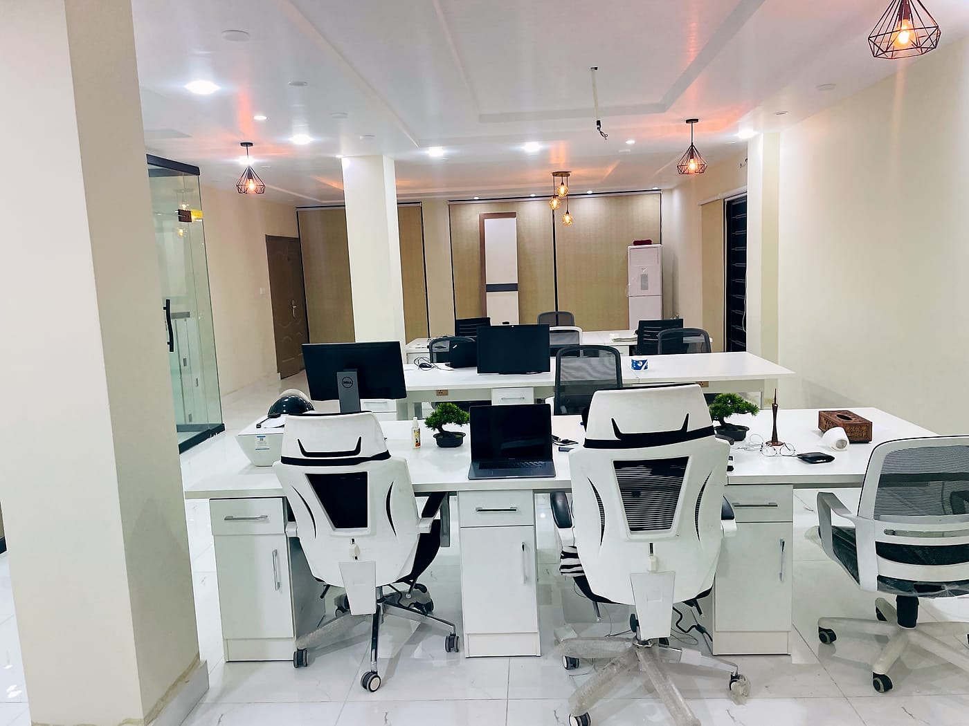Open desks with monitors at CodeUp Spaces, Wapda Town
